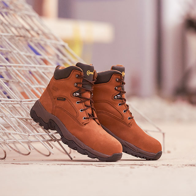 The Graeme 6" Waterproof Comp Toe Hiker in brown on a job site.